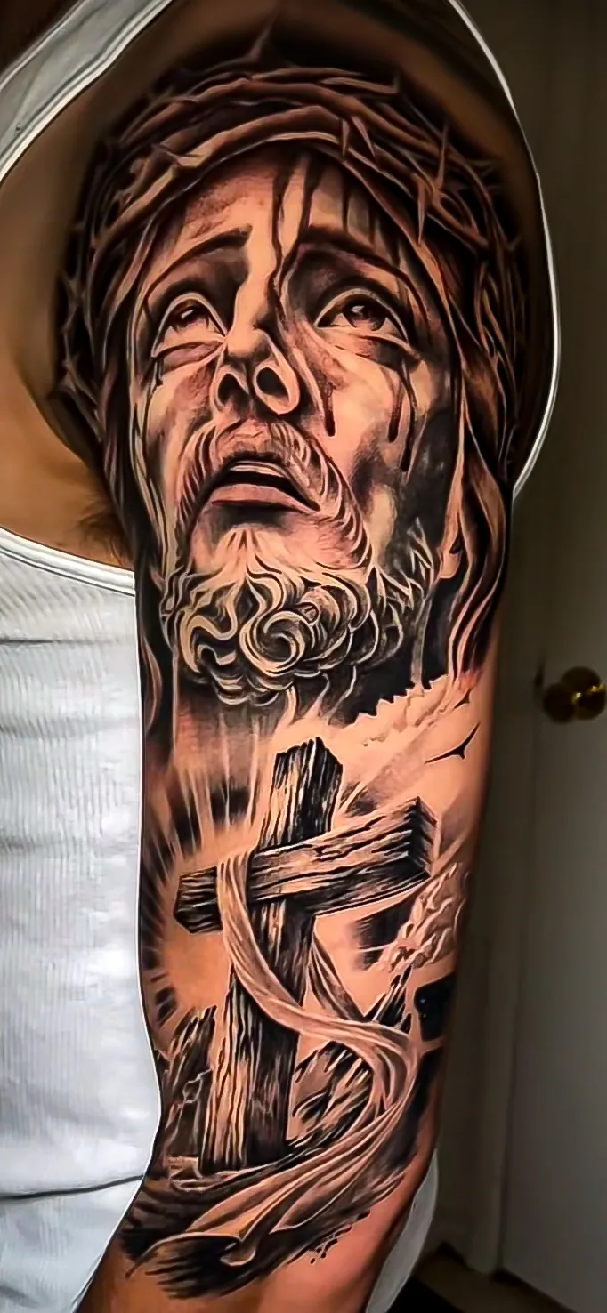 black and grey realism Christ portrait sleeve tattoo by Steve Bachman, Long Beach