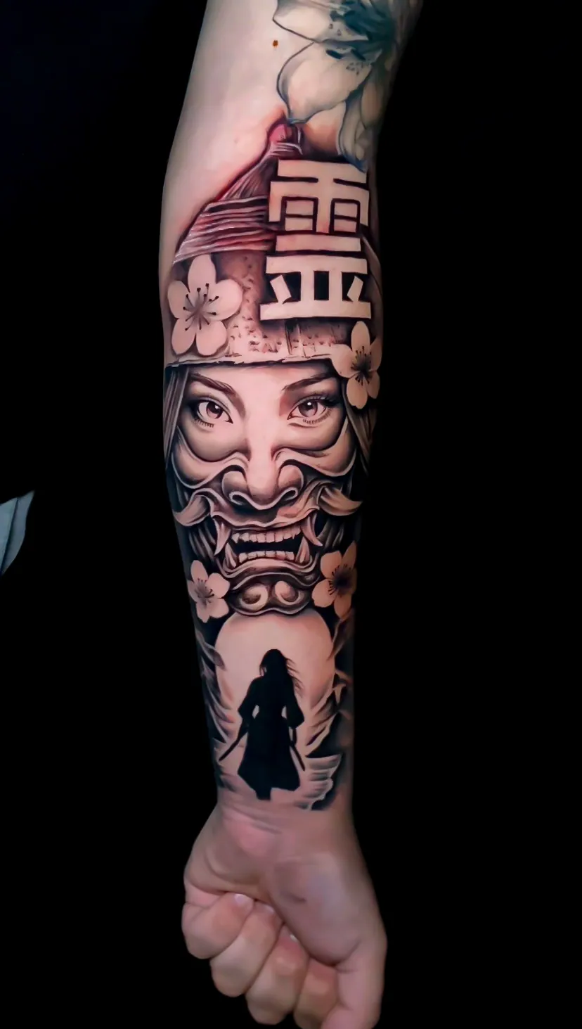 black and grey surreal clown and house forearm tattoo by Steve Bachman, Long Beach