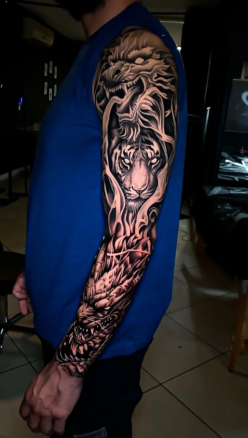 black and grey realism lion full sleeve tattoo by Steve Bachman, Long Beach