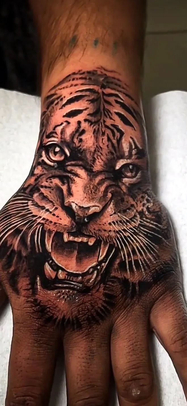 black and grey tiger hand piece tattoo by Steve Bachman, Long Beach