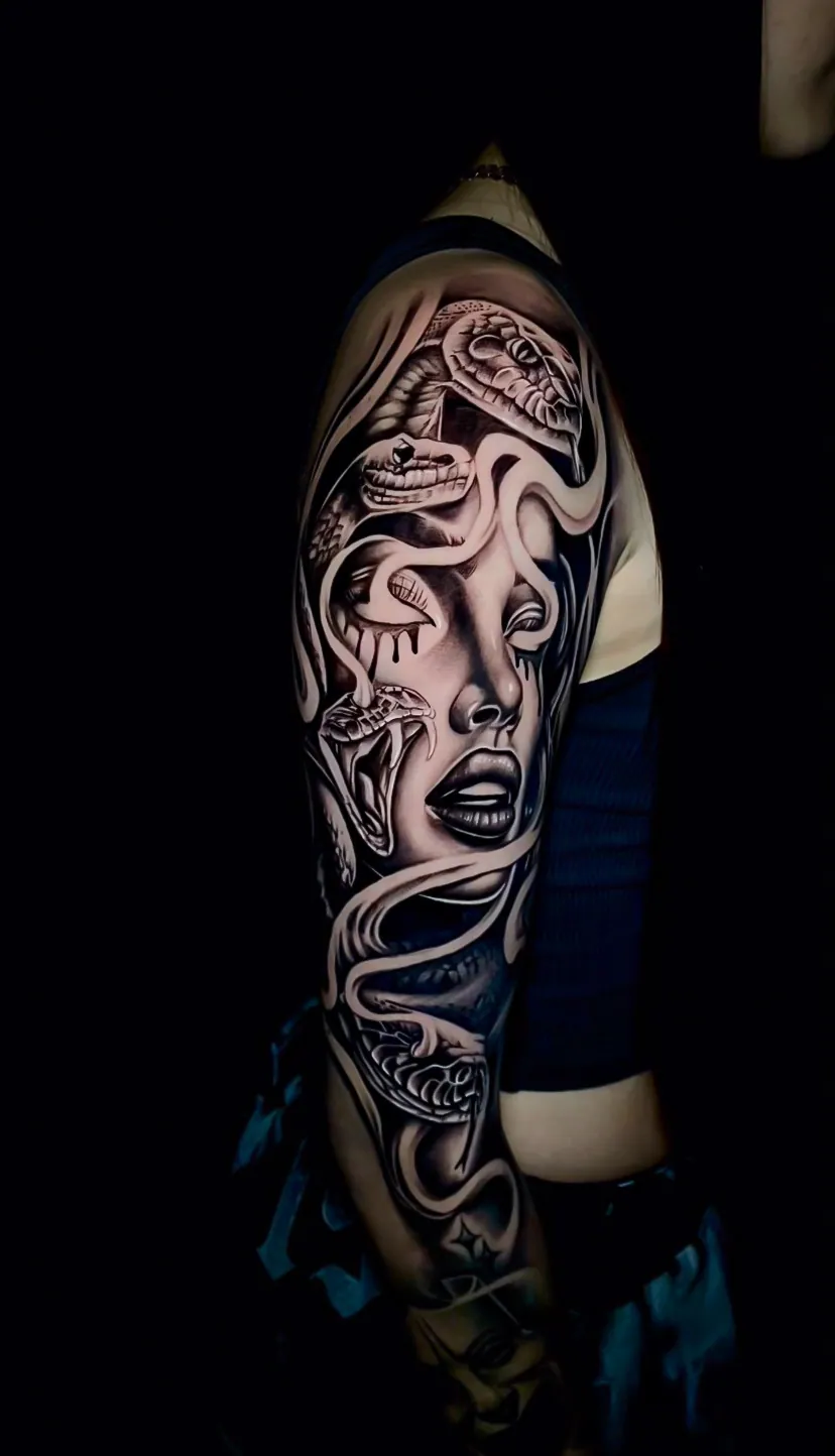 black and grey surrealism woman and smoke sleeve tattoo by Steve Bachman, Long Beach